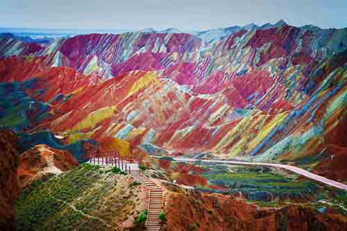 "A visitor stands at a viewing platform in the Zhangye Danxia Landform Geological Park in Zhangye, northwest Chinas Gansu province, 22 September 2012."