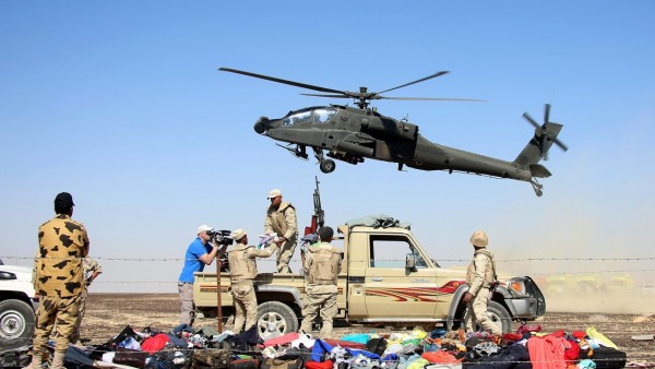 SUEZ, EGYPT - NOVEMBER 01: Egyptian officials inspect the crash site of Russian Airliner in Suez, Egypt on November 01, 2015. A Russian Airbus-321 airliner with 224 people aboard crashed in Egypt's Sinai Peninsula on yesterday. According to Egypts Civil Aviation Authority, the plane had been lost contact with air-traffic controllers shortly after taking off from the Egyptian Red Sea resort city of Sharm el-Sheikh en route to St Petersburg. (Photo by Alaa El Kassas/Anadolu Agency/Getty Images)