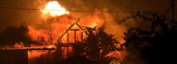 A home burns amidst the Yarnell Hill Fire in Yarnell, Ariz. on Sunday, June 30, 2013. The fire started Friday and picked up momentum as the area experienced high temperatures, low humidity and windy conditions. It has forced the evacuation of residents in the Peeples Valley area and in the town of Yarnell. (AP Photo/The Arizona Republic, Tom Story)