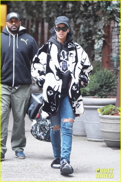 **USA ONLY** *EXCLUSIVE* **SHOT ON 11/23/15** New York, NY - Singer Rihanna seems to have forgotten to take her slippers off as she leaves her hotel in Soho New York, looking stylish in an oversized black and white coat and torn blue jeans. AKM-GSI November 25, 2015 **USA ONLY** To License These Photos, Please Contact : Steve Ginsburg (310) 505-8447 (323) 423-9397 steve@akmgsi.com sales@akmgsi.com or Maria Buda (917) 242-1505 mbuda@akmgsi.com ginsburgspalyinc@gmail.com