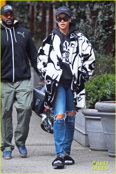 **USA ONLY** *EXCLUSIVE* **SHOT ON 11/23/15** New York, NY - Singer Rihanna seems to have forgotten to take her slippers off as she leaves her hotel in Soho New York, looking stylish in an oversized black and white coat and torn blue jeans. AKM-GSI November 25, 2015 **USA ONLY** To License These Photos, Please Contact : Steve Ginsburg (310) 505-8447 (323) 423-9397 steve@akmgsi.com sales@akmgsi.com or Maria Buda (917) 242-1505 mbuda@akmgsi.com ginsburgspalyinc@gmail.com