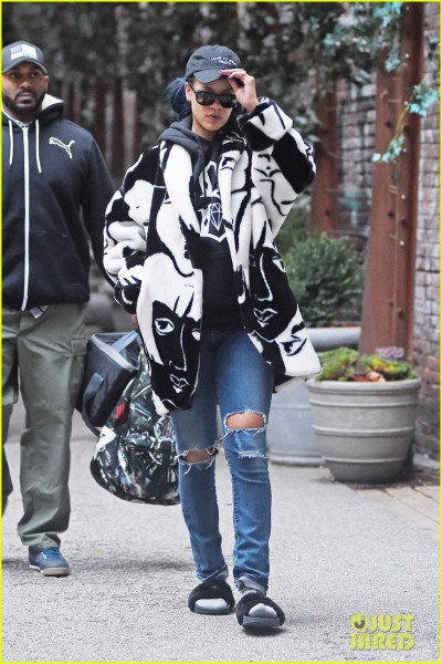 **USA ONLY** *EXCLUSIVE* **SHOT ON 11/23/15** New York, NY - Singer Rihanna seems to have forgotten to take her slippers off as she leaves her hotel in Soho New York, looking stylish in an oversized black and white coat and torn blue jeans. AKM-GSI November 25, 2015 **USA ONLY** To License These Photos, Please Contact : Steve Ginsburg (310) 505-8447 (323) 423-9397 steve@akmgsi.com sales@akmgsi.com or Maria Buda (917) 242-1505 mbuda@akmgsi.com ginsburgspalyinc@gmail.com