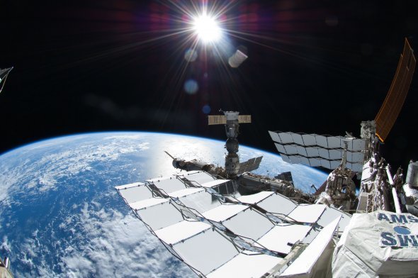 astronaut-ron-garan-captures-the-space-station-the-earth-and-the-sun-during-a-space-walk-july-12