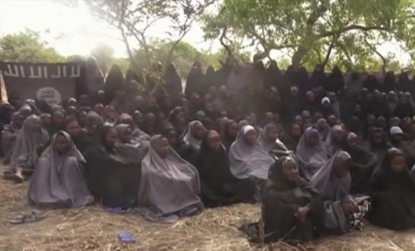 FILE - In this Monday, May. 12, 2014, file image taken from video by Nigeria's Boko Haram terrorist network, shows the alleged missing girls abducted from the northeastern town of Chibok. Soldiers have found one of the girls kidnapped by Boko Haram from a boarding school in Chibok town, her uncle said Wednesday, May. 18, 2016 describing her as pregnant and traumatized but otherwise fine. Amina Ali Nkeki is the first of the 219 so-called Chibok girls to be freed since the mass abduction that grabbed attention around the world more than two years ago. (AP Photo/File)