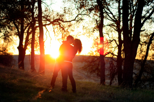couple in forest sunset