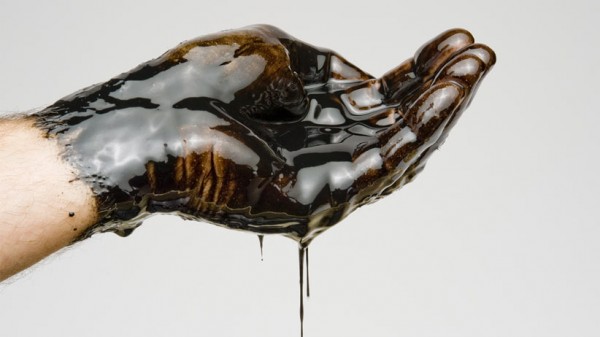 Hand Full of Oil. Getty Images
