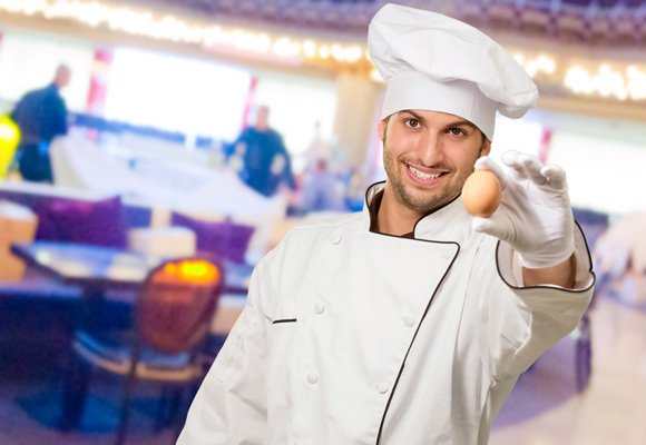 young-male-chef-holding-an-egg