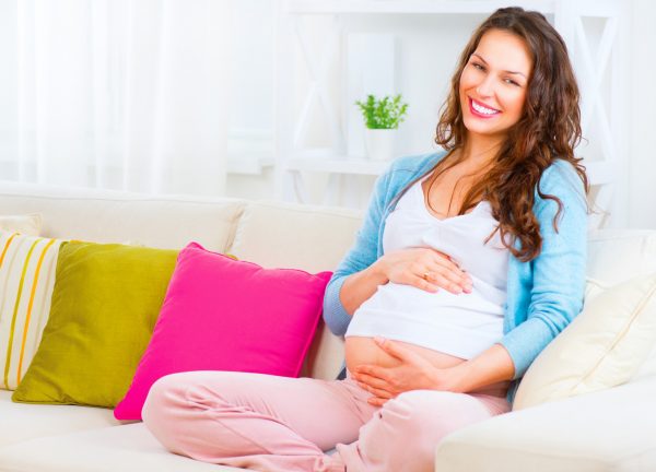 bigstock-pregnant-happy-smiling-woman-s-77746199